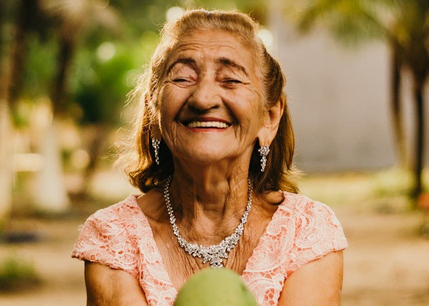 woman wearing pink dress holding fruit